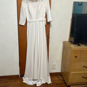White 3/4 sleeve polyester wedding gown.  New with tags